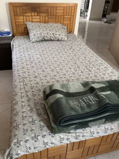 2 single beds and 2 almari