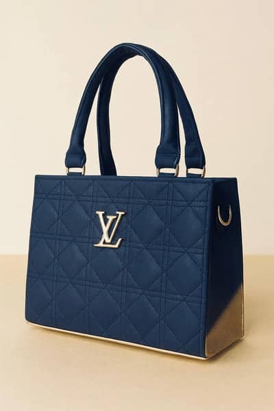 blue quilted shoulder bag with gold hardware of woman