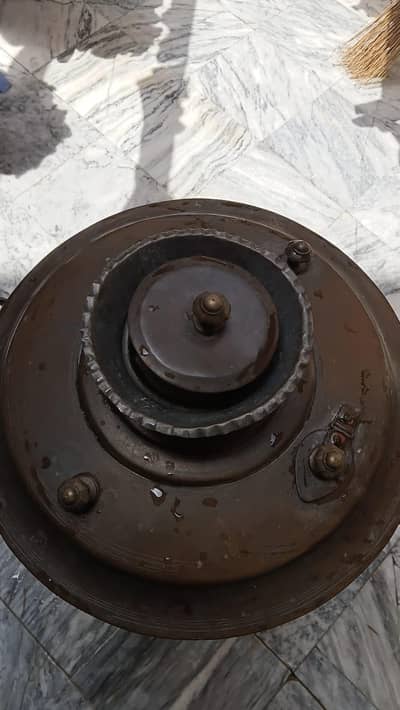 65 year old copper water container