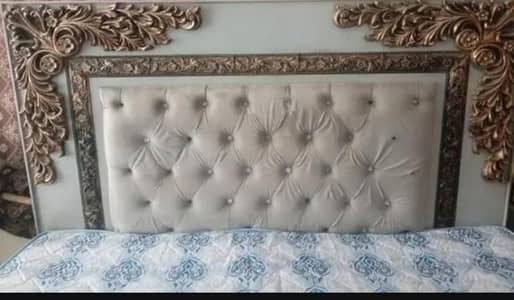 king size bed with side table and dressing table