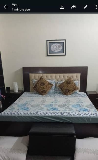 Bed with dresser and side tables