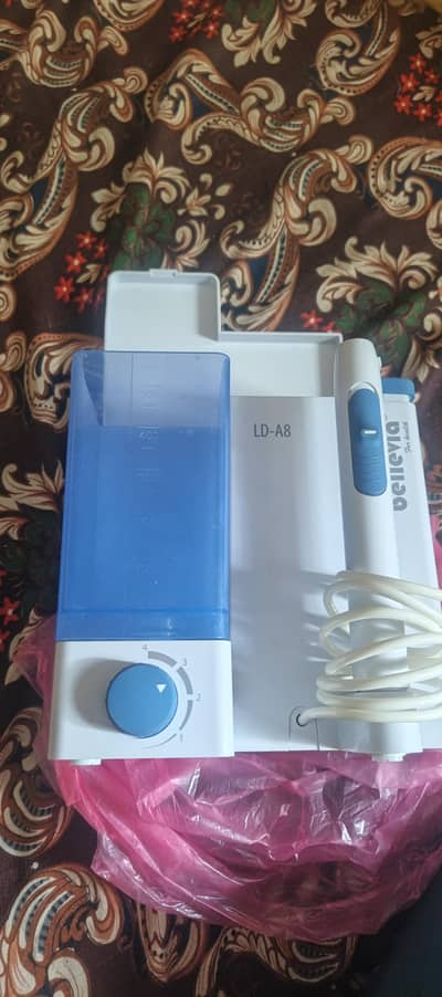 ORAL IRRIGATOR