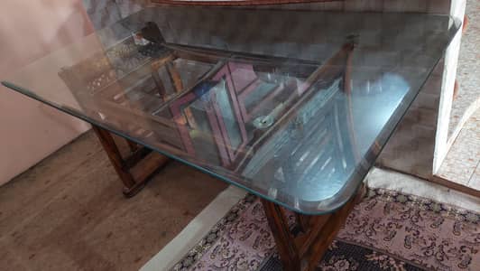 Dining table with four wooden chairs with Thick and heavy Glass