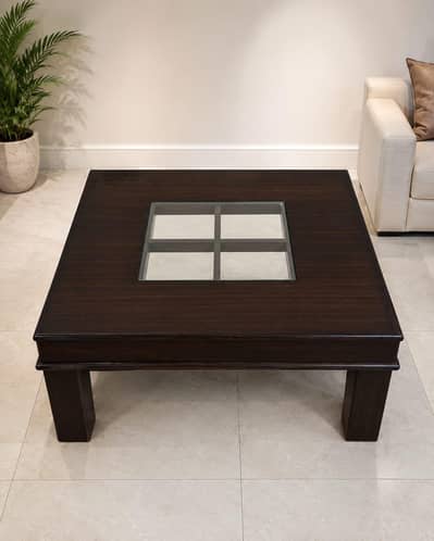 Centre Table made of wood having glass in the center
