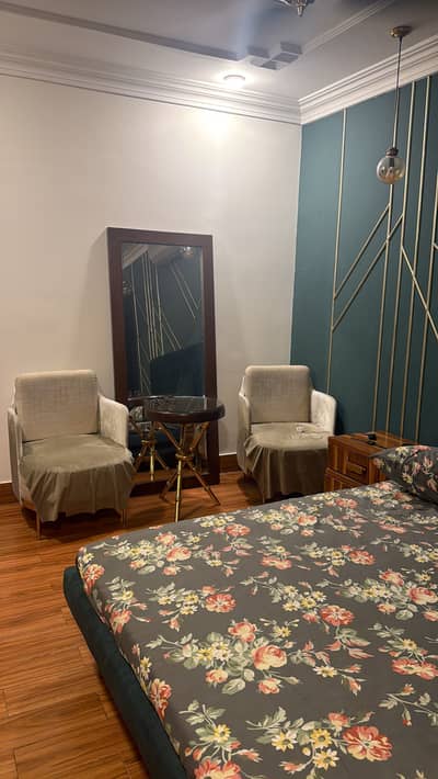 Bed, wardrobe, chairs and mirror.