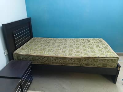 Two single beds with side tables