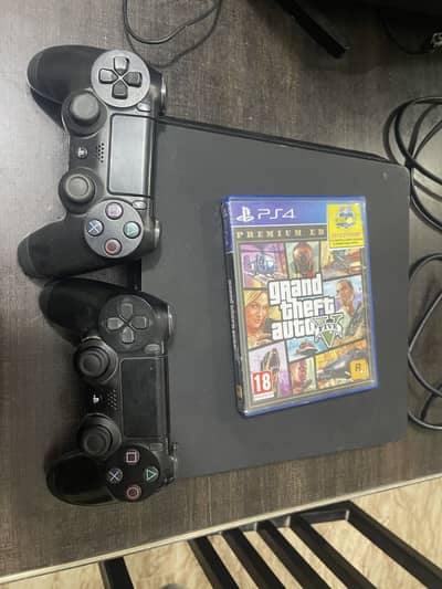 PlayStation 4 Slim with 2 Controllers and GTA 5 Disc