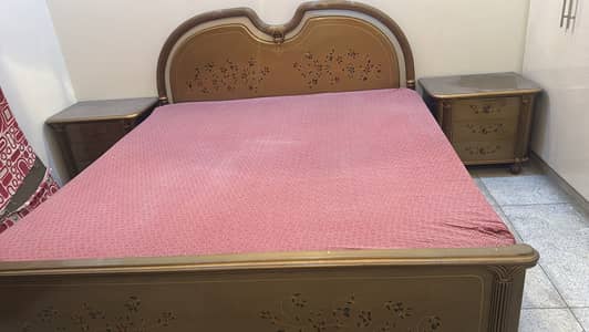 Queen size double bed with side tables and mattress