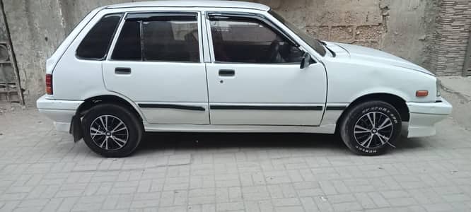 white color Suzuki kheyber