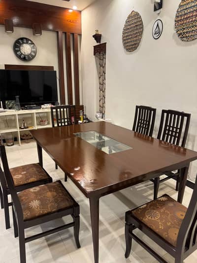 Wooden dining table with six chairs