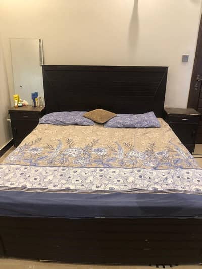 wooden bed and 2 side tables with mattress