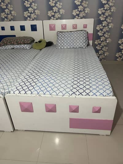 Elegant wooden beds with dressing table and study table