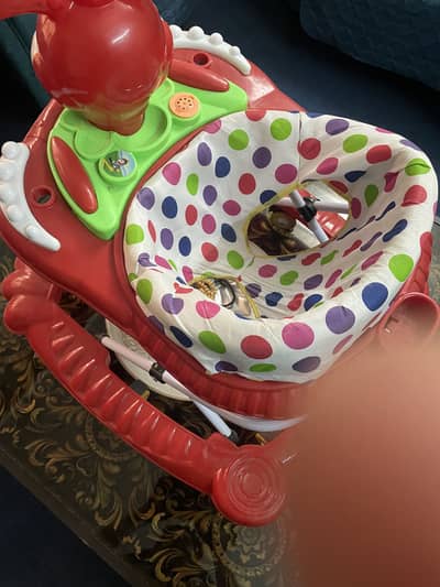 Baby walker and baby sitting couch for sale in accumulate condition