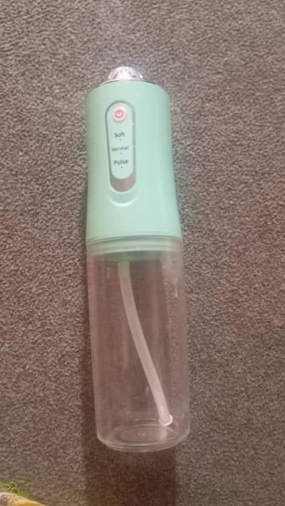portable oral irrigator