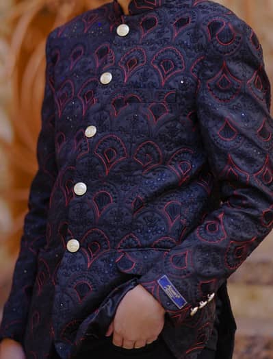 black and sequence work coat