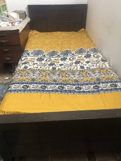 2 single wooden beds