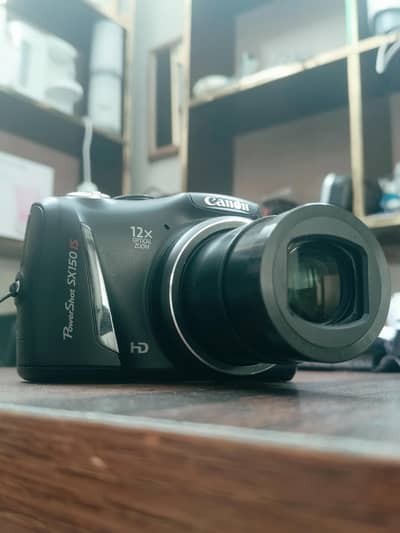 Canon PowerShot SX150 IS 14.1 Mega pixel  Digital Camera