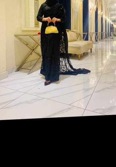 Elegant black net sarrhi.
