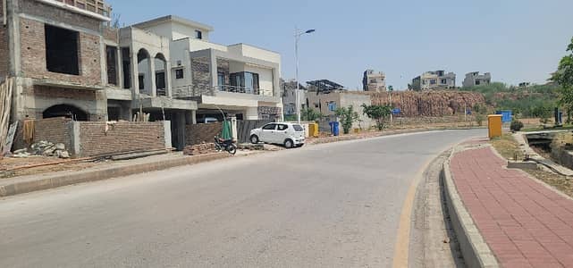 10 Marla with some extra land on main boulevard sunfacing with big front. Dem 105 Slightly negotiable
