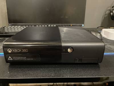 Xbox 360 e with box and games