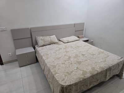 Bed with side tables and mirror
