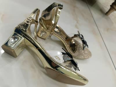 branded and elegant stopy heels