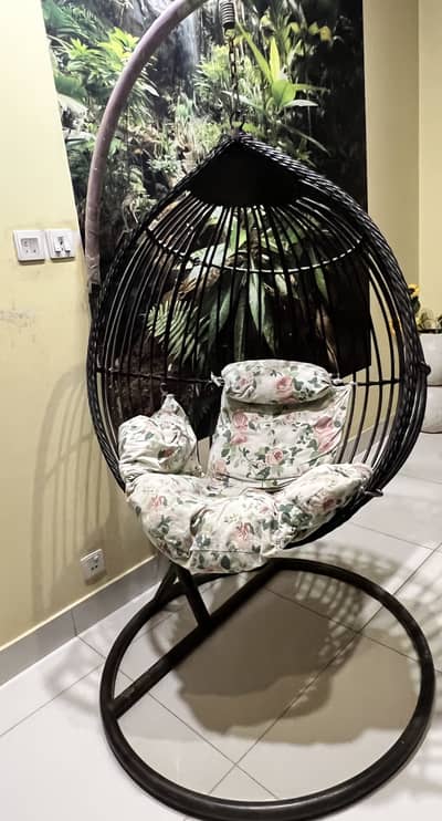 Stylish indoor/outdoor swing chair with cushions