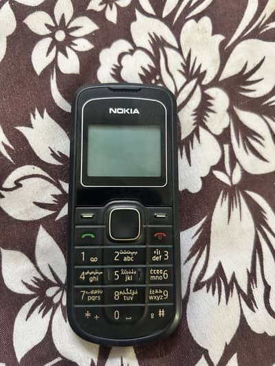 Nokia 1202-2 Geniunge for sale with Charger