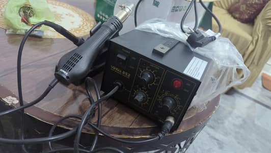 SMD and multimeter and soldering iron and pcb holder and iron stand