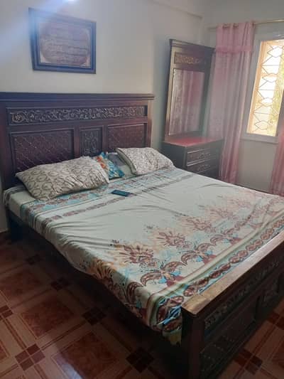 completely bed and dresser table