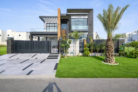 Magnificent One Kanal Contemporary Designer Bungalow Featuring Sophisticated Architecture, Luxurious Interior Finishes, A Prime Location Just Steps Away From Carrefour Market.