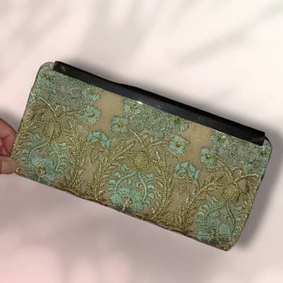Party wear branded clutch