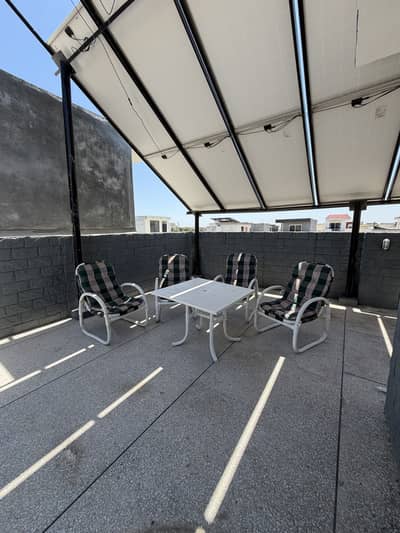 Four chair with table and umbrella