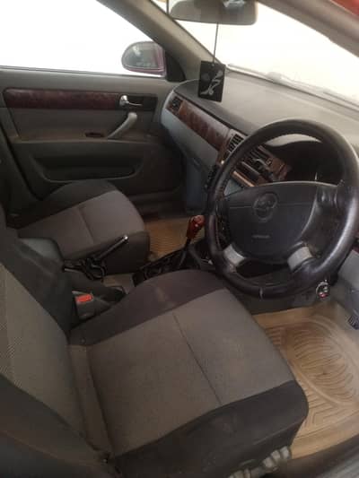 cheverolet optra better than corolla liana honda city
