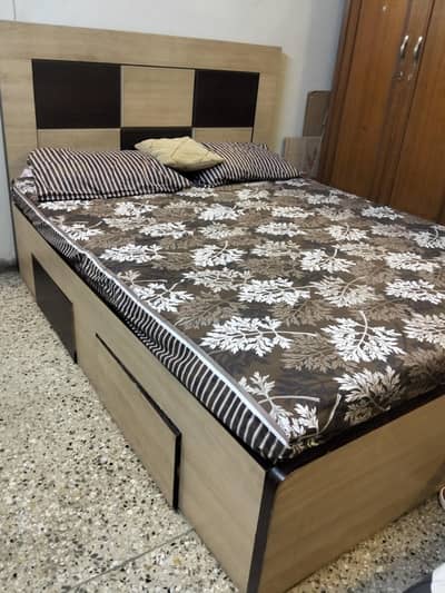wooden bed with mattress