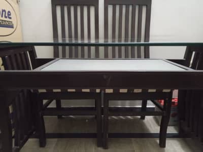 Dinning table with glass top and 6 chairs