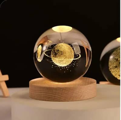 3D crystal ball lamp with golden glow & USB recharge.