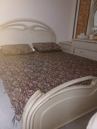 Bed with side tables for sale.