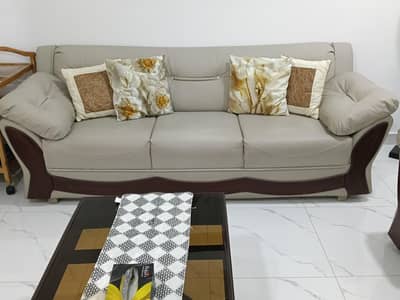 five seater sofa and center table