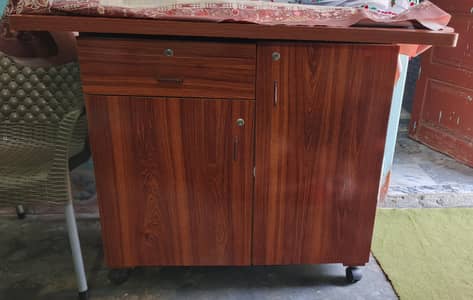 Iron stand with 1 drawer and 2 cabinets.
