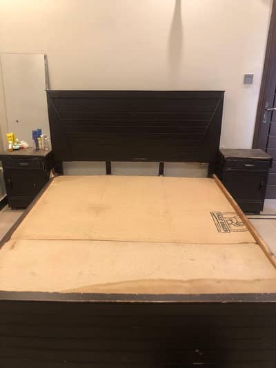 wooden bed and mattress