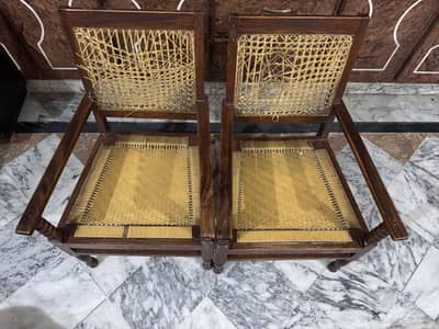 A pair of old wooden chairs