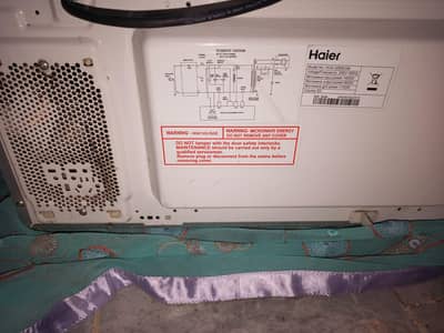 Haier microwave. 32L. model. No. HGN. 3290. EGM.