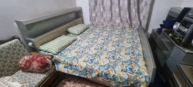 full size bed and side table