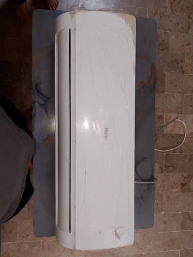 Haier 1.5 ton AC only 1 year used with under warranty for urgent sale.