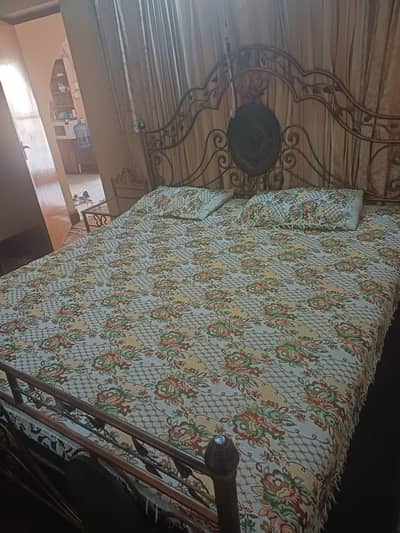used iron bed with 2 side tables and dressing table complete set.