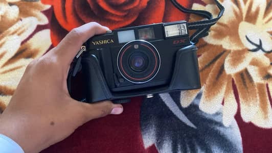 This is a Yashica MF-2 Super DX 35mm film camera from the 1980s,