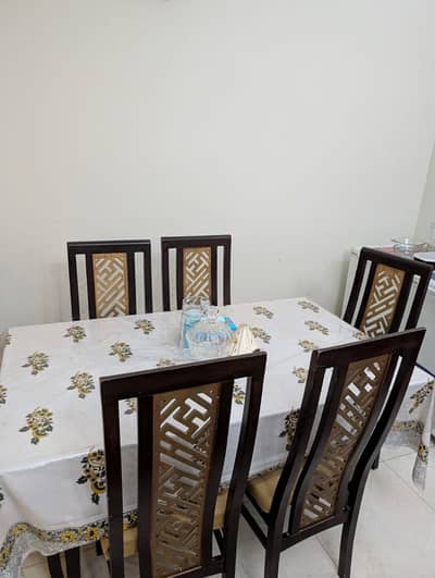 wooden dining set with glass top