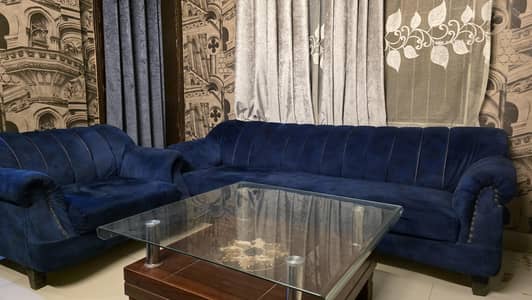 5 seater sofa and one centre Glass table