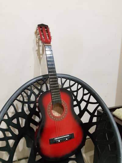 Sunburst acoustic guitar and two guitar picks (price is negotiable)